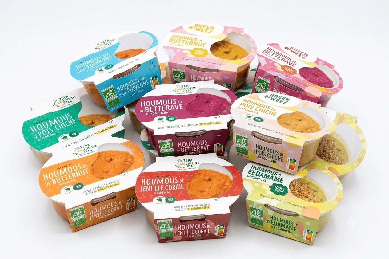 Gamme de houmous SudOvégé en pots : pois chiche, betterave, butternut, lentille corail, edamame et deux poivrons, déclinés sous plusieurs marques